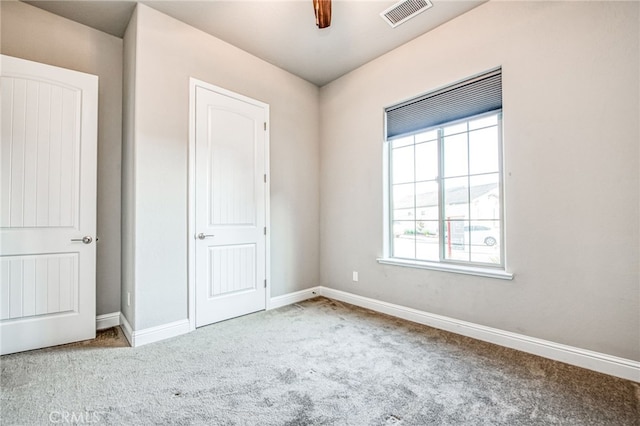 unfurnished bedroom with carpet floors and ceiling fan