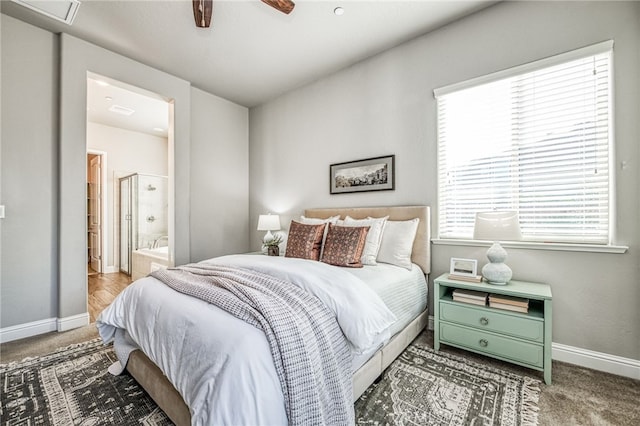 bedroom featuring carpet floors, ceiling fan, and ensuite bathroom