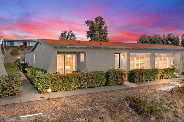 view of property exterior at dusk