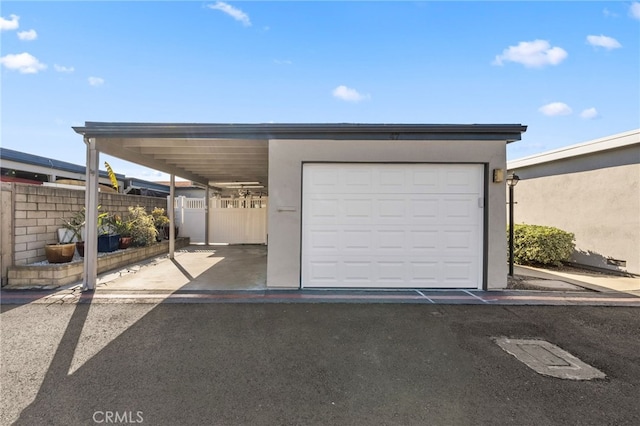 garage featuring a carport