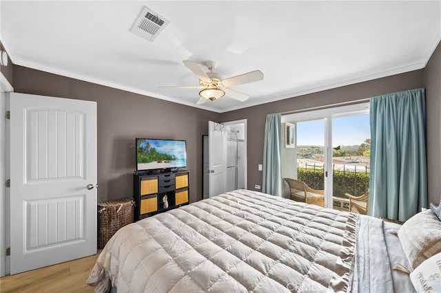 bedroom featuring access to exterior, ornamental molding, ceiling fan, and light wood-type flooring