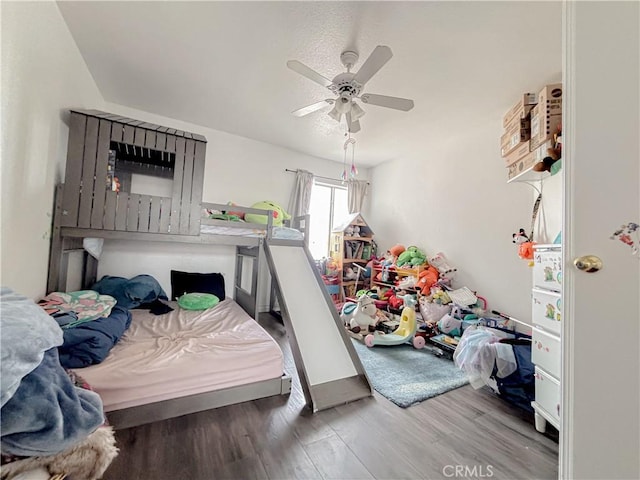 bedroom with hardwood / wood-style floors and ceiling fan