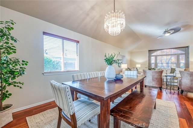 1585 W Riverglen Ave, Reedley, CA 93654 - dining area featuring dark wood-type flooring, vaulted ceiling, and an inviting chandelier