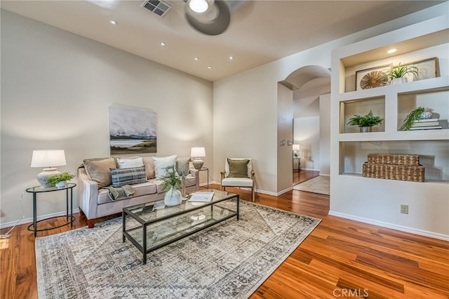 1585 W Riverglen Ave, Reedley, CA 93654 - living room with hardwood / wood-style flooring and built in features