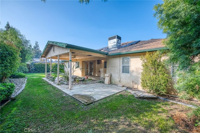 1585 W Riverglen Ave, Reedley, CA 93654 - rear view of house featuring a patio area, solar panels, a yard, cooling unit, and ceiling fan