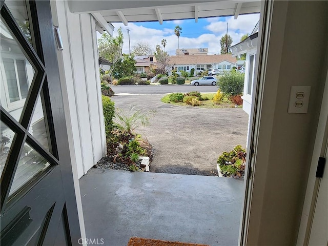 doorway with concrete flooring and plenty of natural light