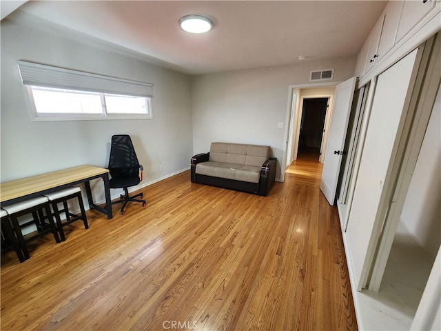 sitting room with light hardwood / wood-style flooring