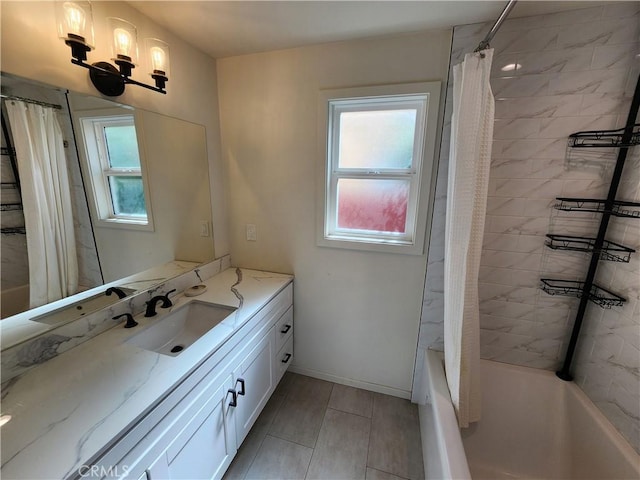 bathroom featuring vanity, a wealth of natural light, and shower / tub combo