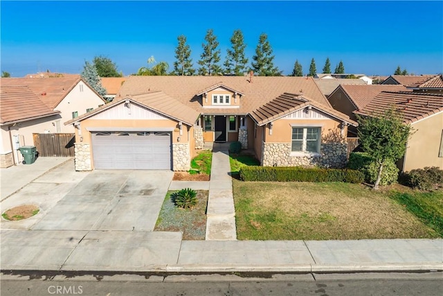 view of front facade featuring a garage and a front yard