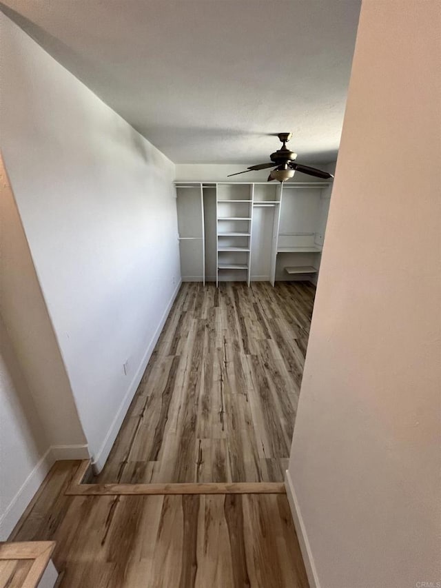 interior space featuring ceiling fan and hardwood / wood-style floors