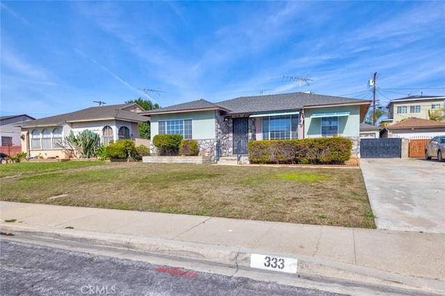 ranch-style home with a front yard