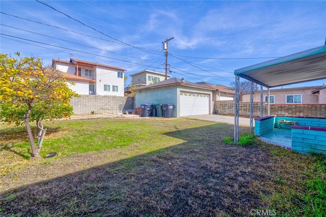 view of yard with an outbuilding and a garage