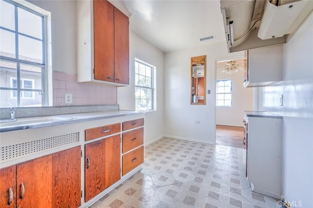 kitchen featuring sink and decorative backsplash