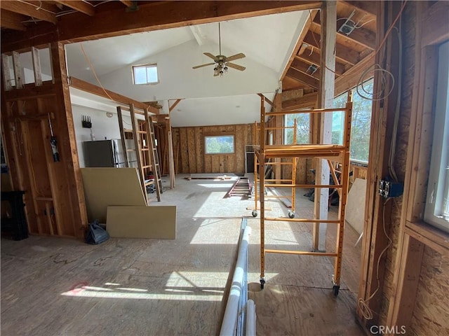 miscellaneous room featuring ceiling fan and high vaulted ceiling