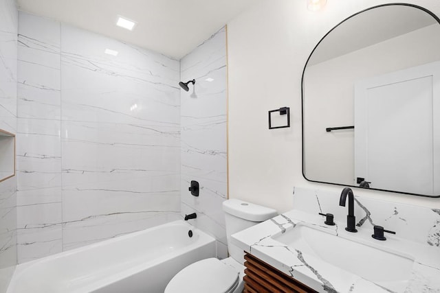 full bathroom featuring vanity, toilet, and tiled shower / bath combo