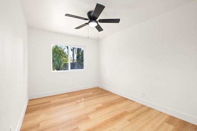 unfurnished room featuring hardwood / wood-style floors and ceiling fan