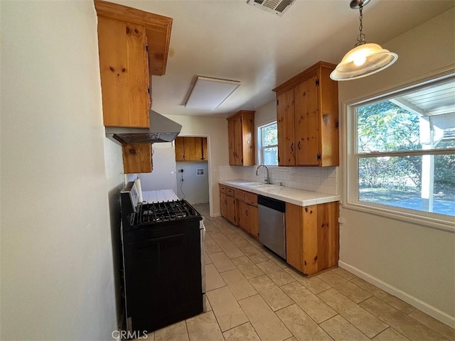 kitchen with tile countertops, visible vents, black gas range, stainless steel dishwasher, and a sink