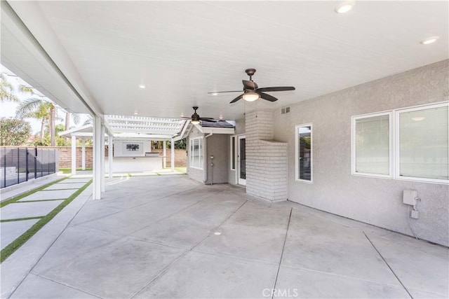 view of patio / terrace featuring fence and a ceiling fan