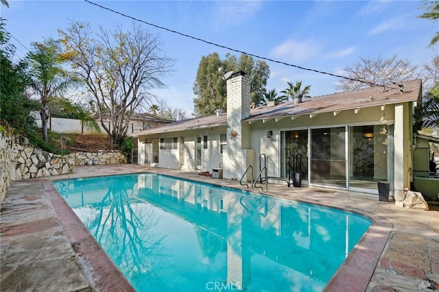 view of pool featuring a patio