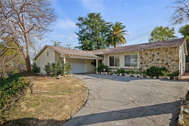 ranch-style house featuring a garage