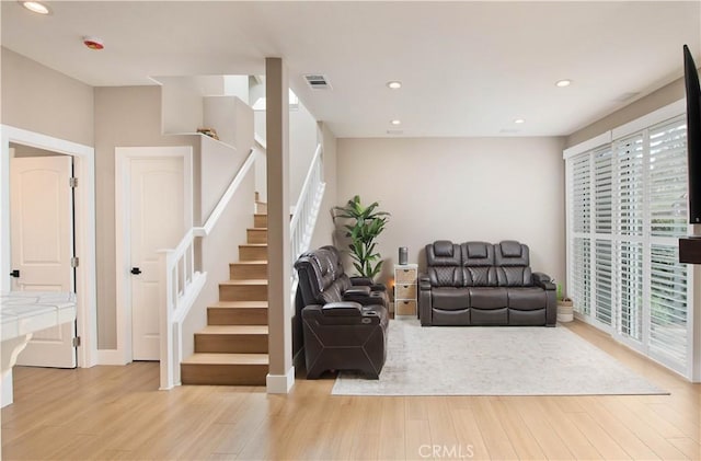 living room with light hardwood / wood-style floors