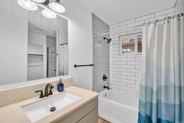 bathroom featuring vanity and shower / tub combo