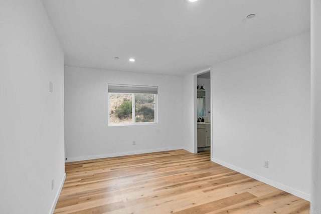 empty room with light wood-type flooring