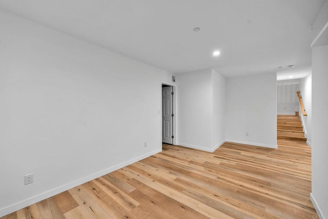 spare room featuring light wood-type flooring