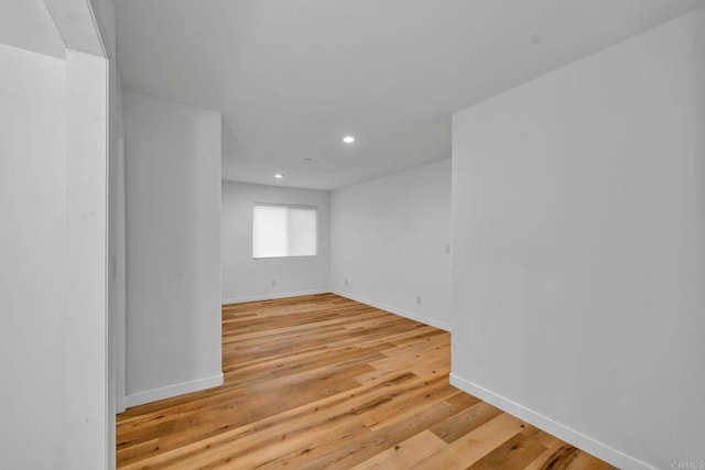 spare room with light hardwood / wood-style floors