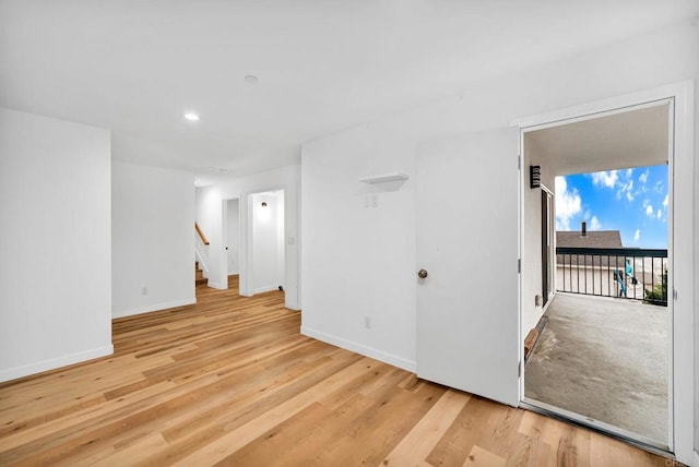 spare room featuring light wood-type flooring