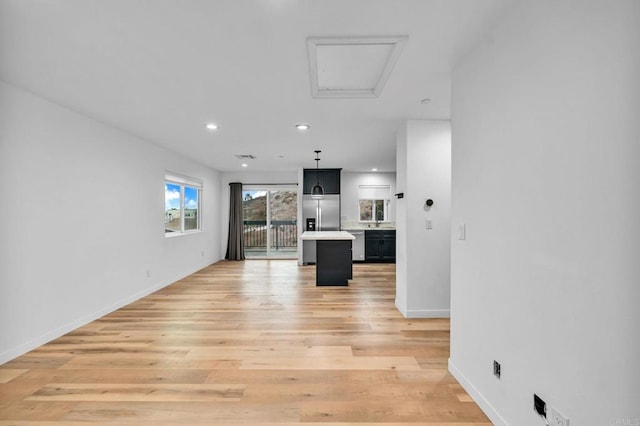 unfurnished living room with light hardwood / wood-style flooring