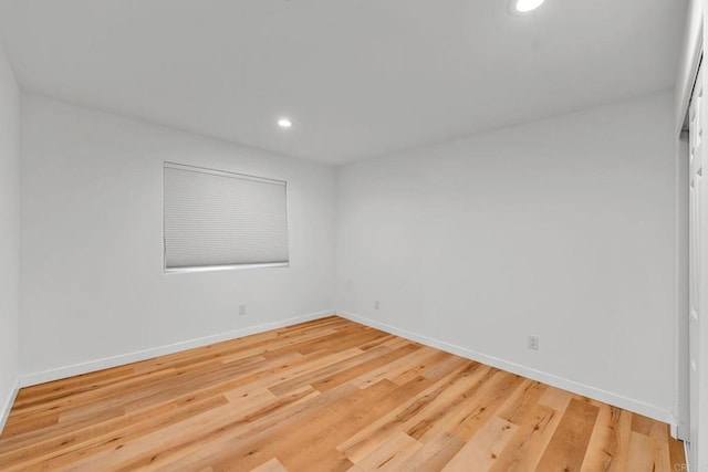 unfurnished room featuring hardwood / wood-style floors