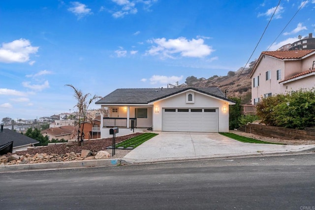 view of front of property featuring a mountain view and a garage