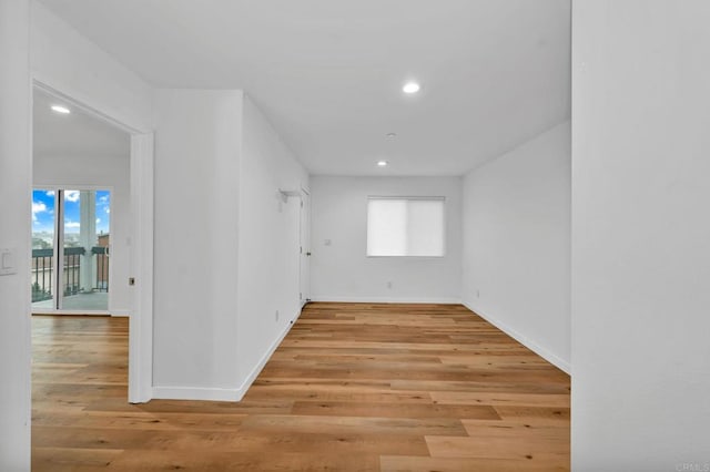 empty room with light hardwood / wood-style floors