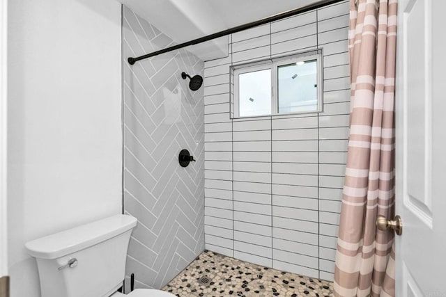 bathroom with toilet and walk in shower