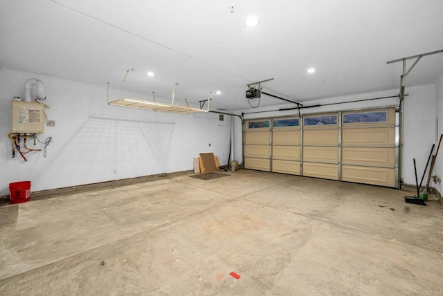 garage featuring a garage door opener and water heater