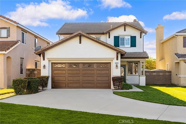 view of front of house featuring a tile roof, stucco siding, an attached garage, driveway, and a front lawn