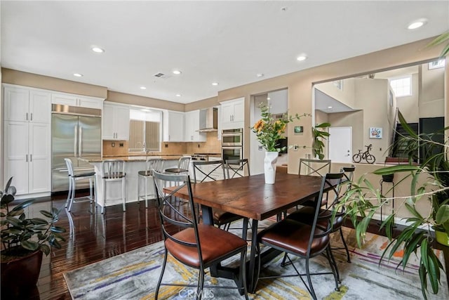 dining area featuring visible vents, dark wood-style flooring, and recessed lighting