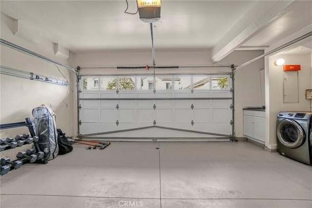 garage featuring washer / dryer and a garage door opener