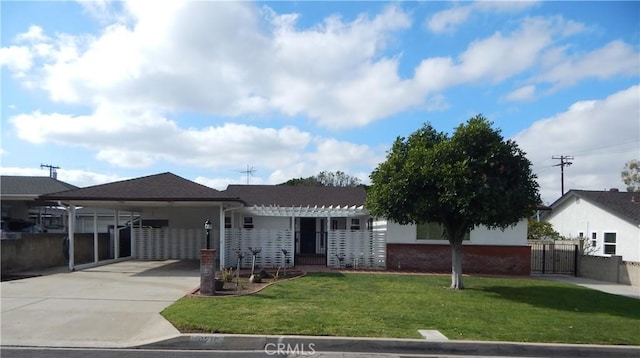 ranch-style home with a carport and a front yard