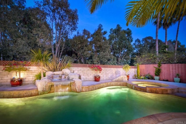 view of swimming pool with an in ground hot tub, a fenced backyard, and a fenced in pool