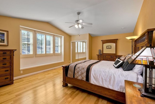 bedroom with baseboards, wood finished floors, a ceiling fan, and vaulted ceiling