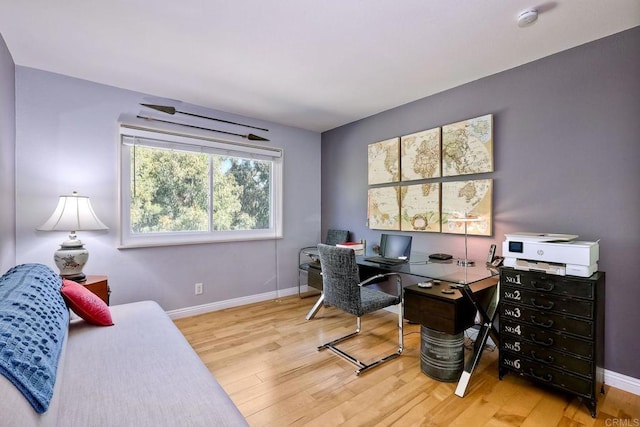 office area featuring wood finished floors and baseboards