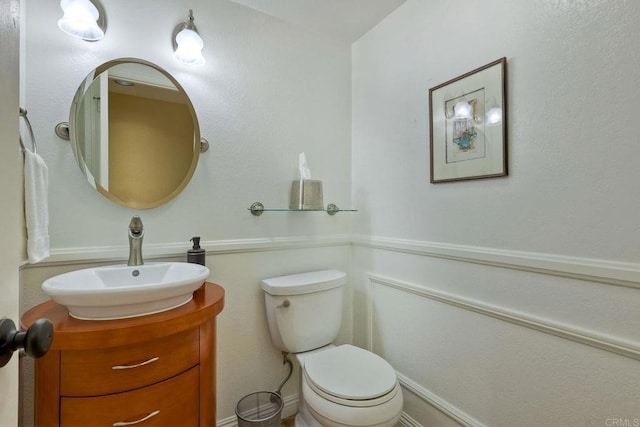 half bath with toilet and vanity