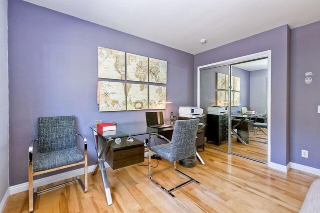 office area featuring wood finished floors and baseboards