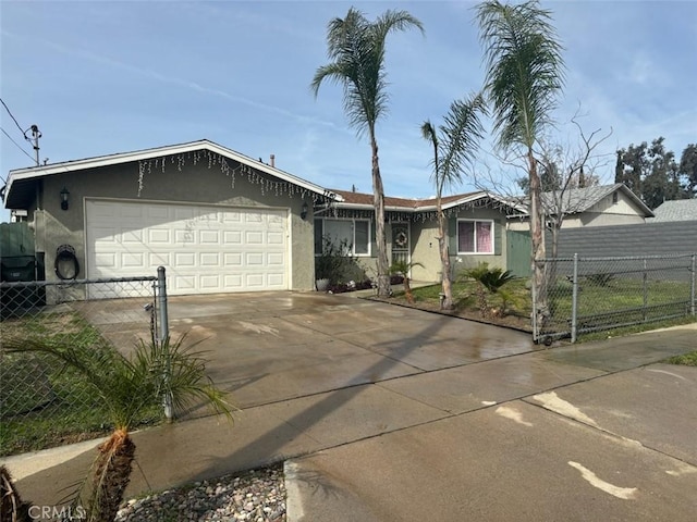 ranch-style home with driveway, fence, and stucco siding