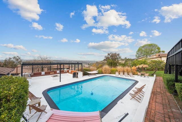 outdoor pool featuring a patio