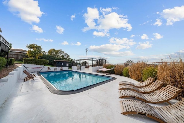 view of pool with a patio area and a fenced in pool