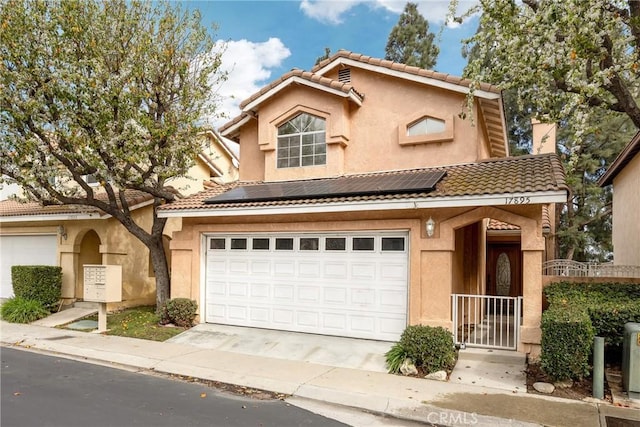 view of front of home featuring solar panels