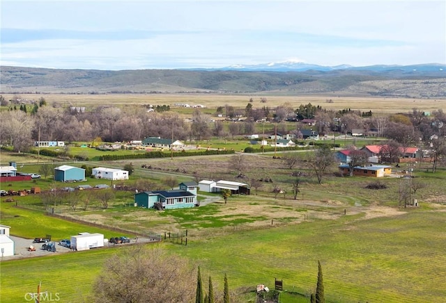 bird's eye view featuring a mountain view and a rural view